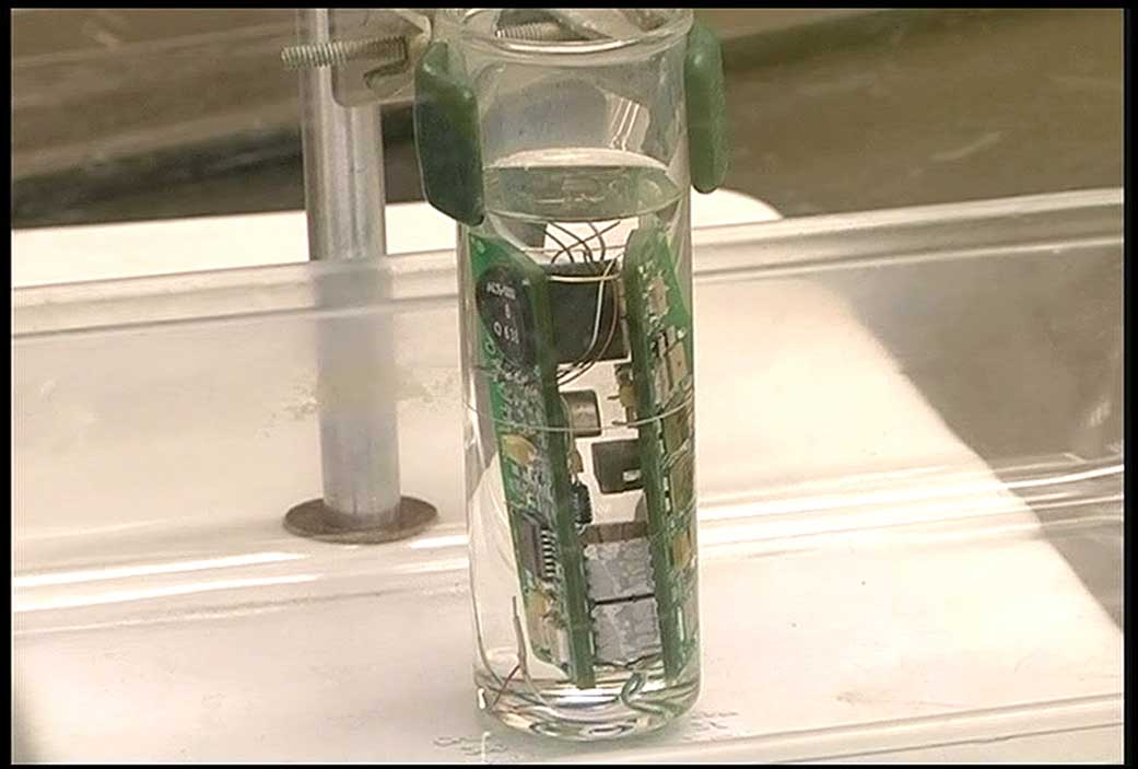 An immersion test of a pressure transducer circuit board in hydrazine.