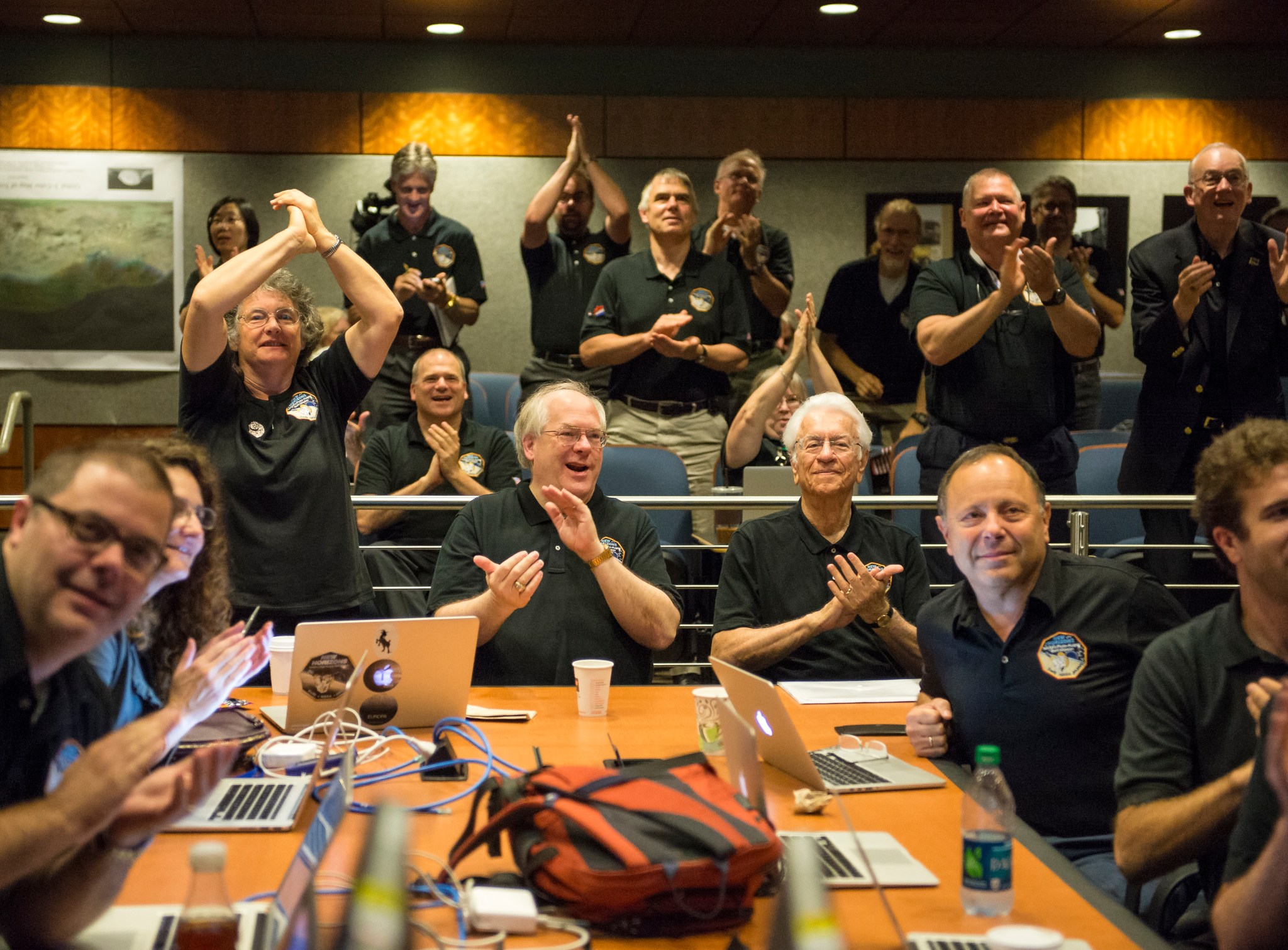 Members of the New Horizons science team react to seeing the spacecraft's last and sharpest image of Pluto