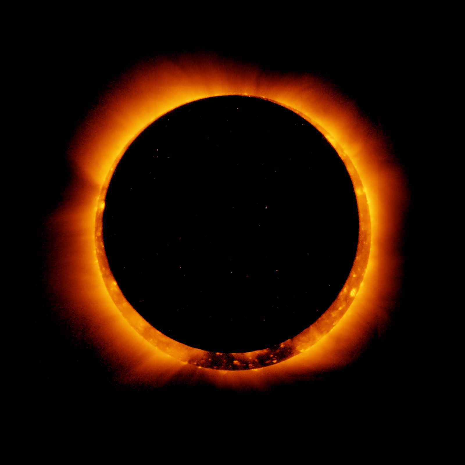 Solar eclipse with the light of the sun forming a border around the edge of the darkened moon