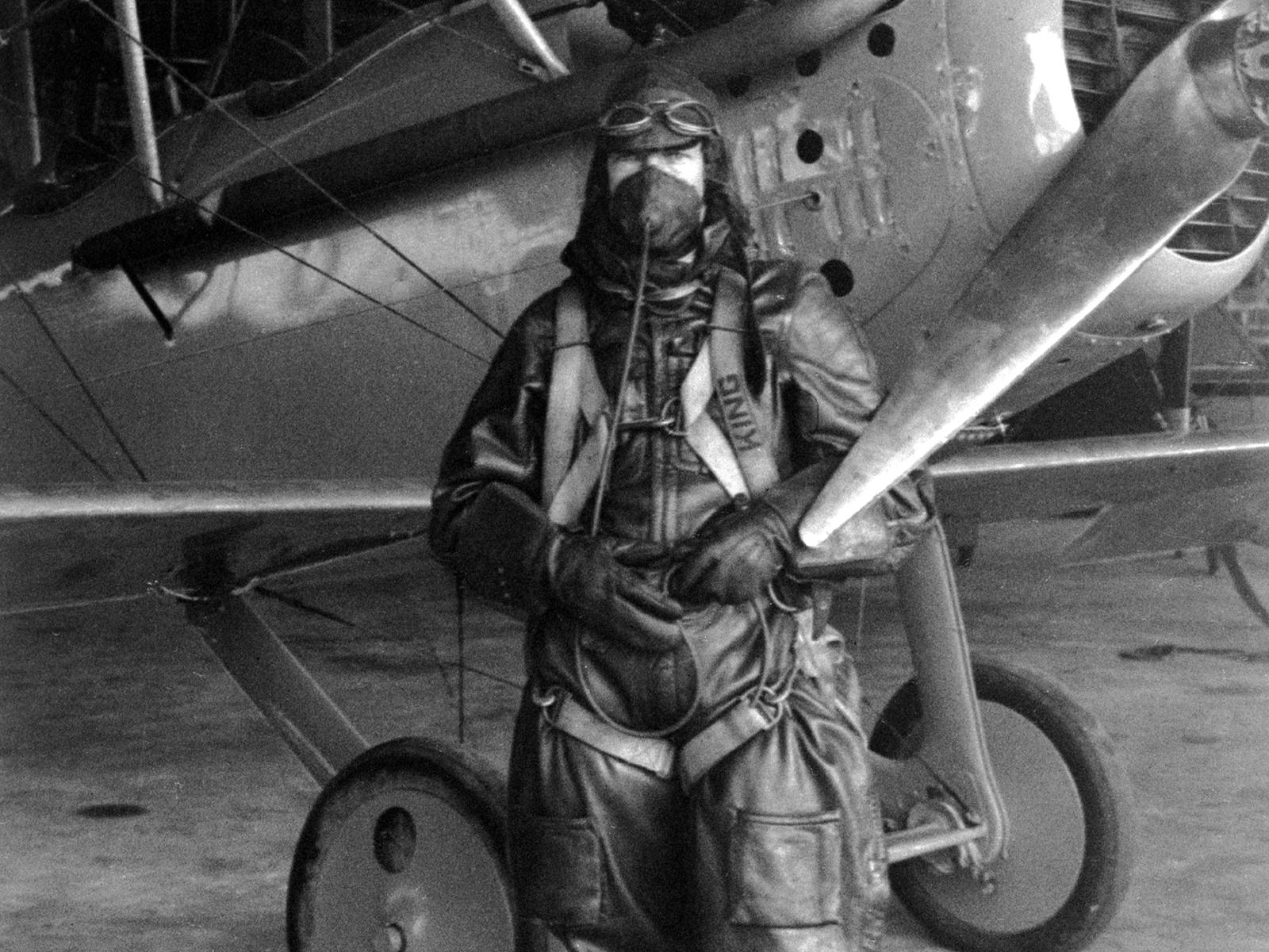 Black and white photo of NACA test pilot Paul King standing in front of Vought VE-7.