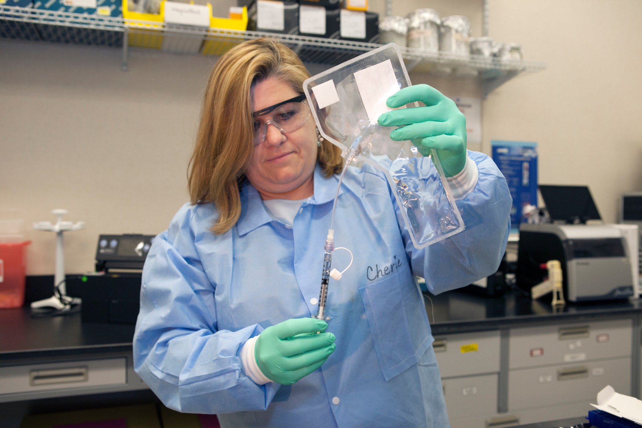 Cherie Oubre prepares a sample of water for testing in the RAZOR EX monitoring system.