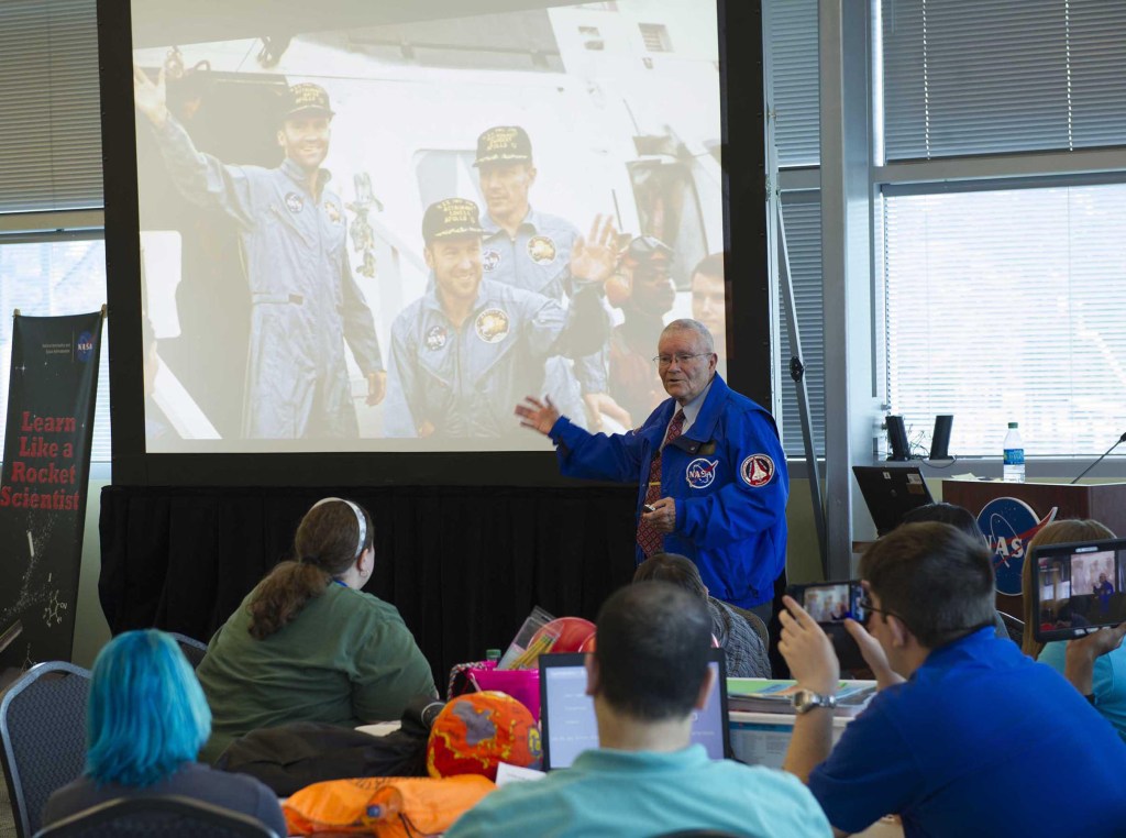 Apollo 13 astronaut Fred Haise talks about his mission experience during a Stennis-hosted workshop for community college students interested in STEM careers