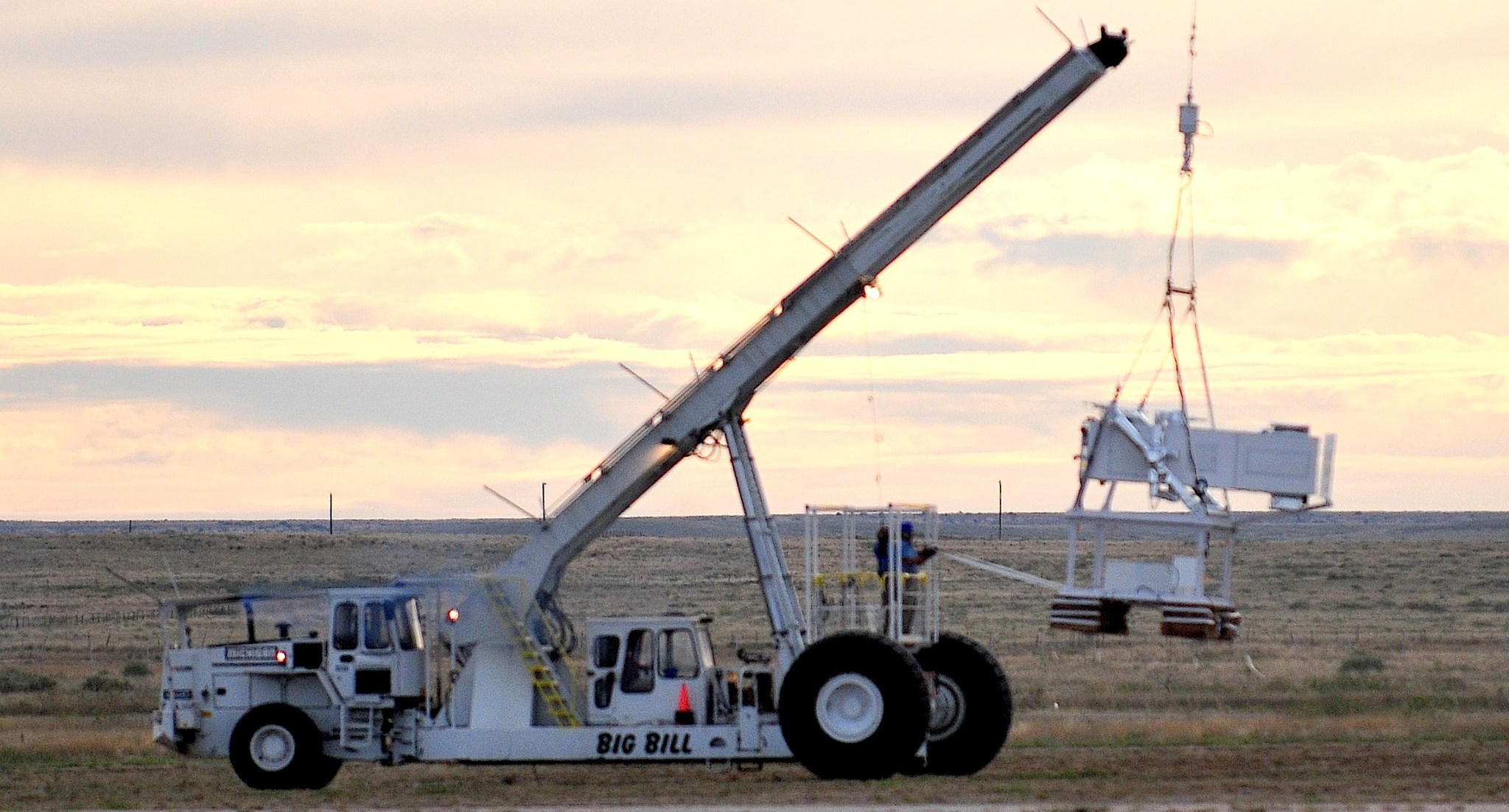 Seconds after its release from the launching crane, NASA Wallops' WASP / OPIS instruments are ready to be hauled skyward.