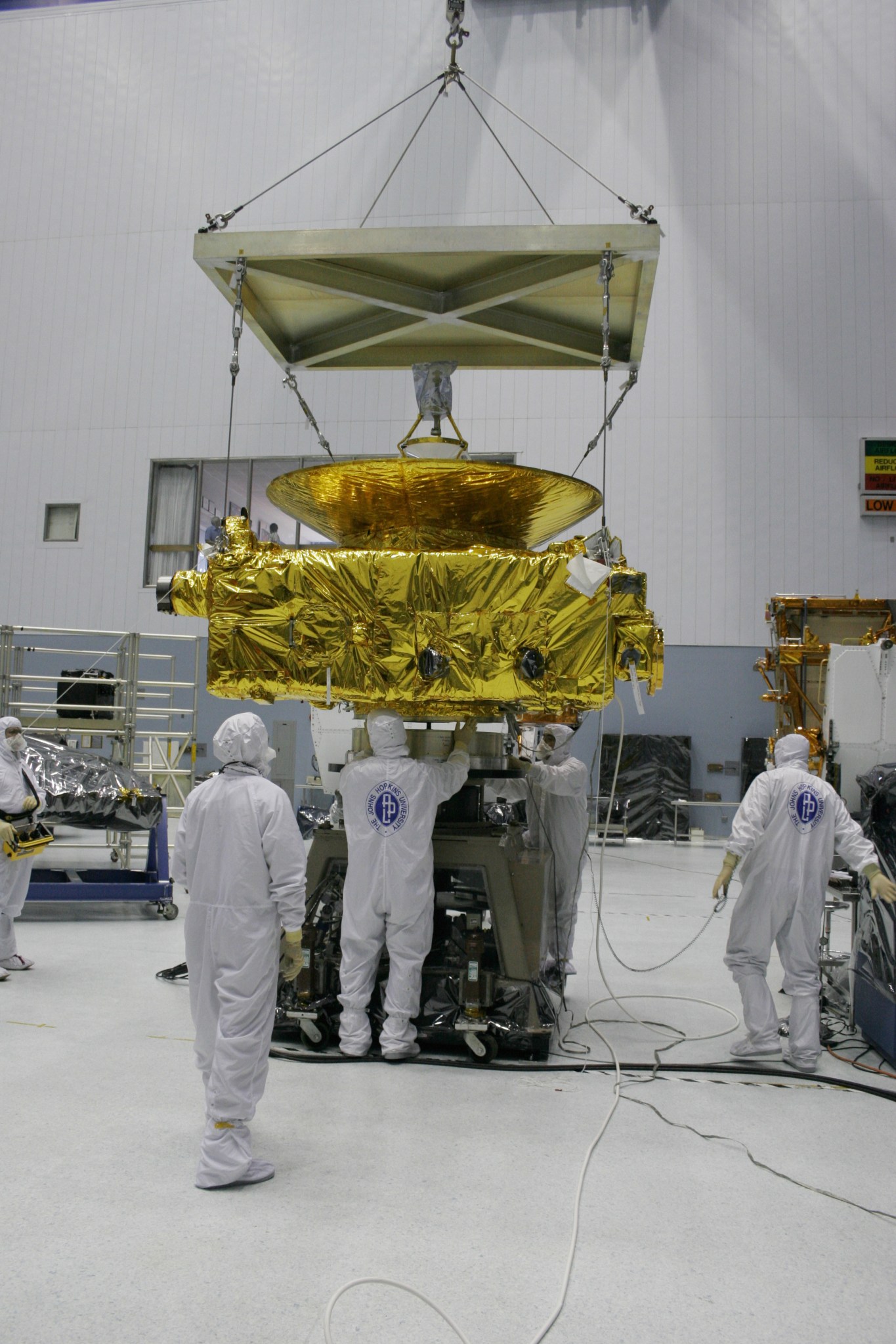The New Horizons team readies the spacecraft for spin-balance tests at NASA's Goddard Space Flight Center.