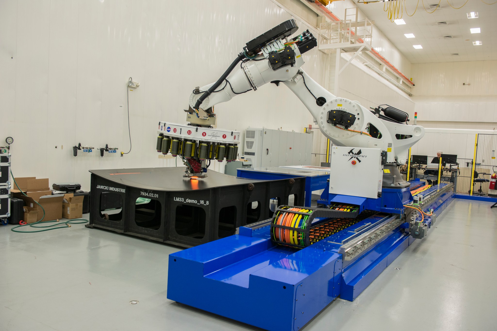 The 21-foot robot arm moves on a track in the Composites Technology Center in NASA’s National Center for Advanced Manufacturing.
