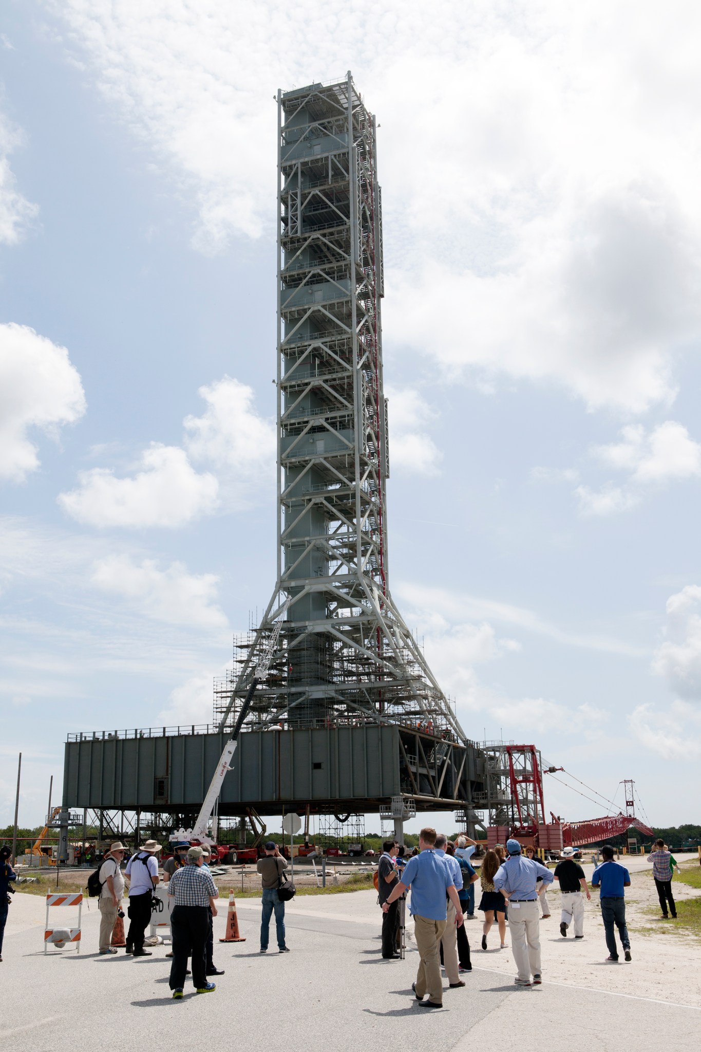 Members of the media view the mobile launcher at NASA's Kennedy Space Center in Florida.