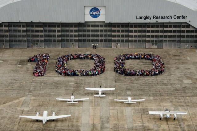 This is an aerial photo of NASA Langley Research Center's hangar in 2017. To celebrate Langley's centennial, Langley personnel stood outside the hangar and formed the number "100."