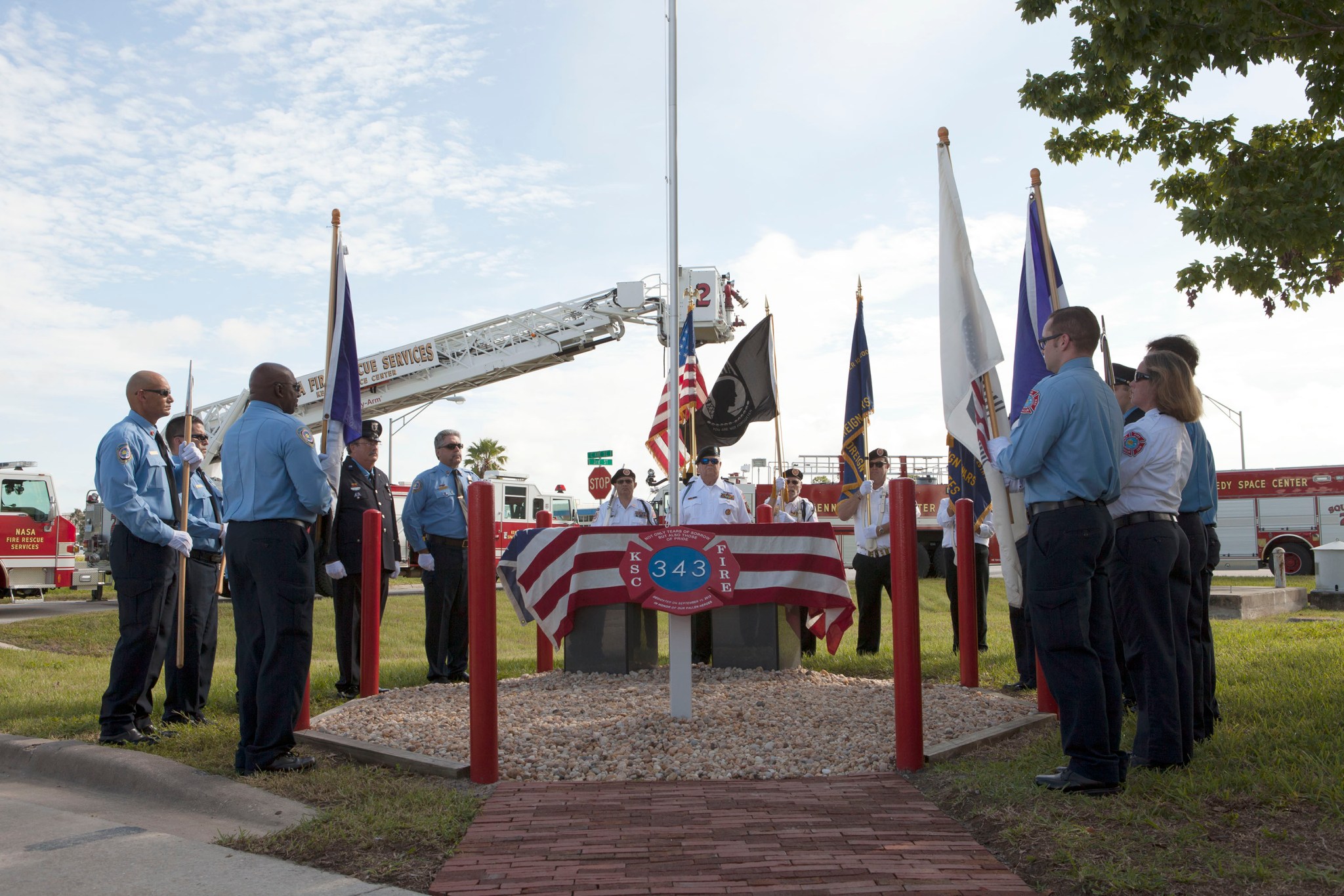 The honor guard for the Fire Department at NASA's Kennedy Space Center conducts the dedication service for a memorial