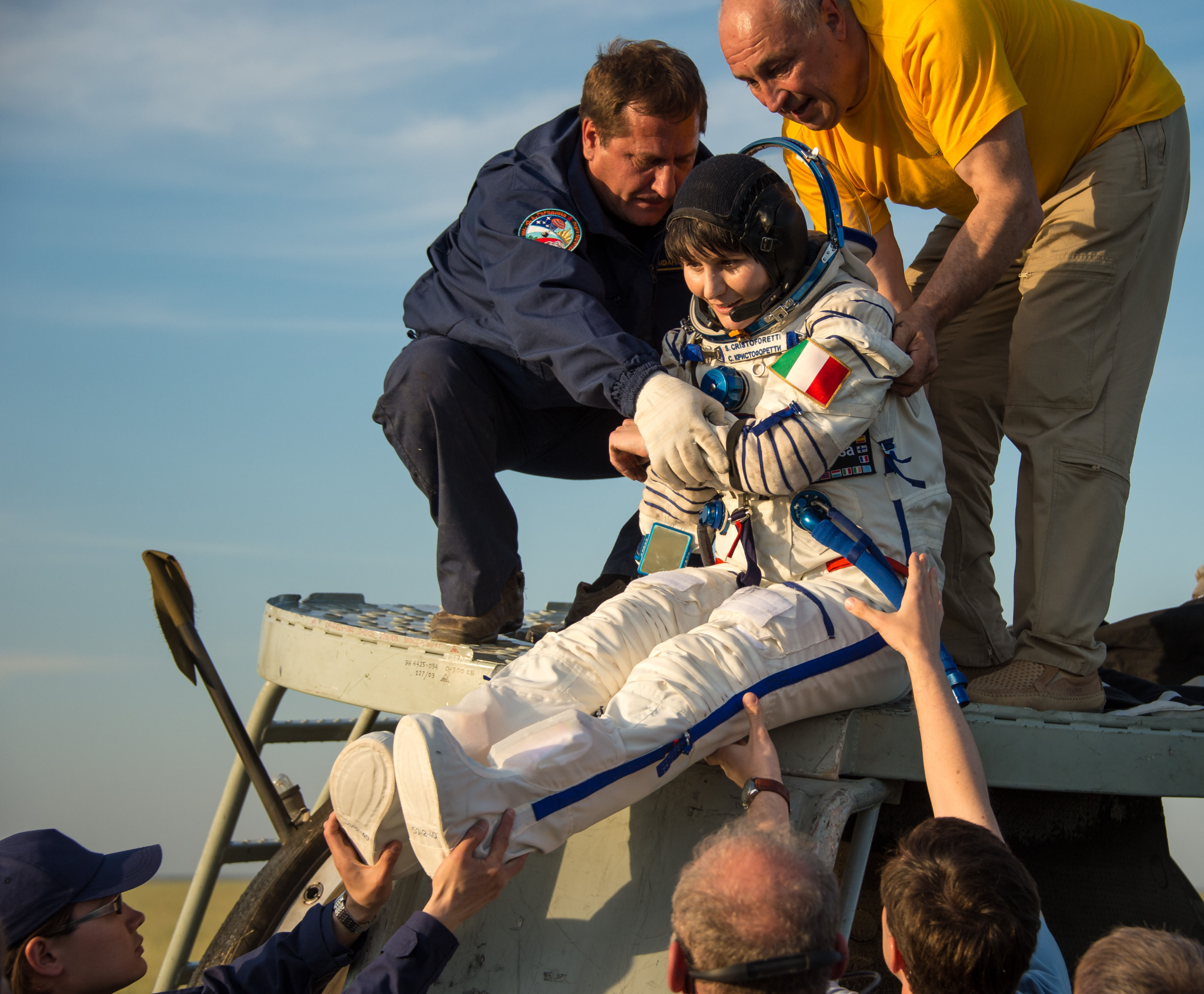 Expedition 43 Italian astronaut Samantha Cristoforetti from European Space Agency (ESA) is helped out of the Soyuz TMA-15M spacecraft just minutes after she landed in a remote area in Kazakhstan on Thursday, June 11, 2015.