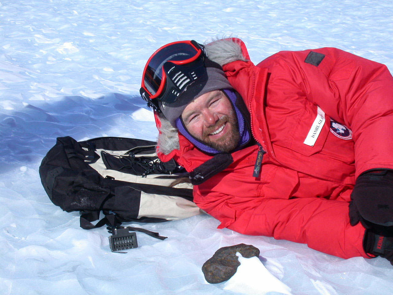 Danny with a meteorite in Antarctica
