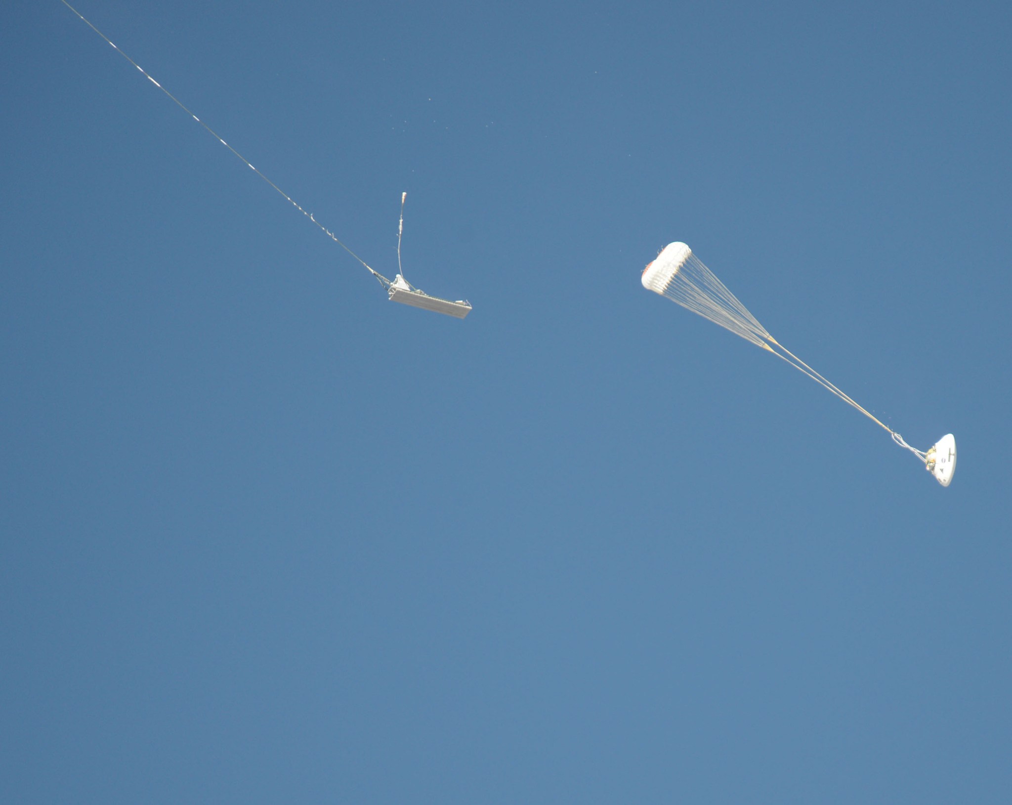 An Orion parachute test enters a new phase following separation from a platform.
