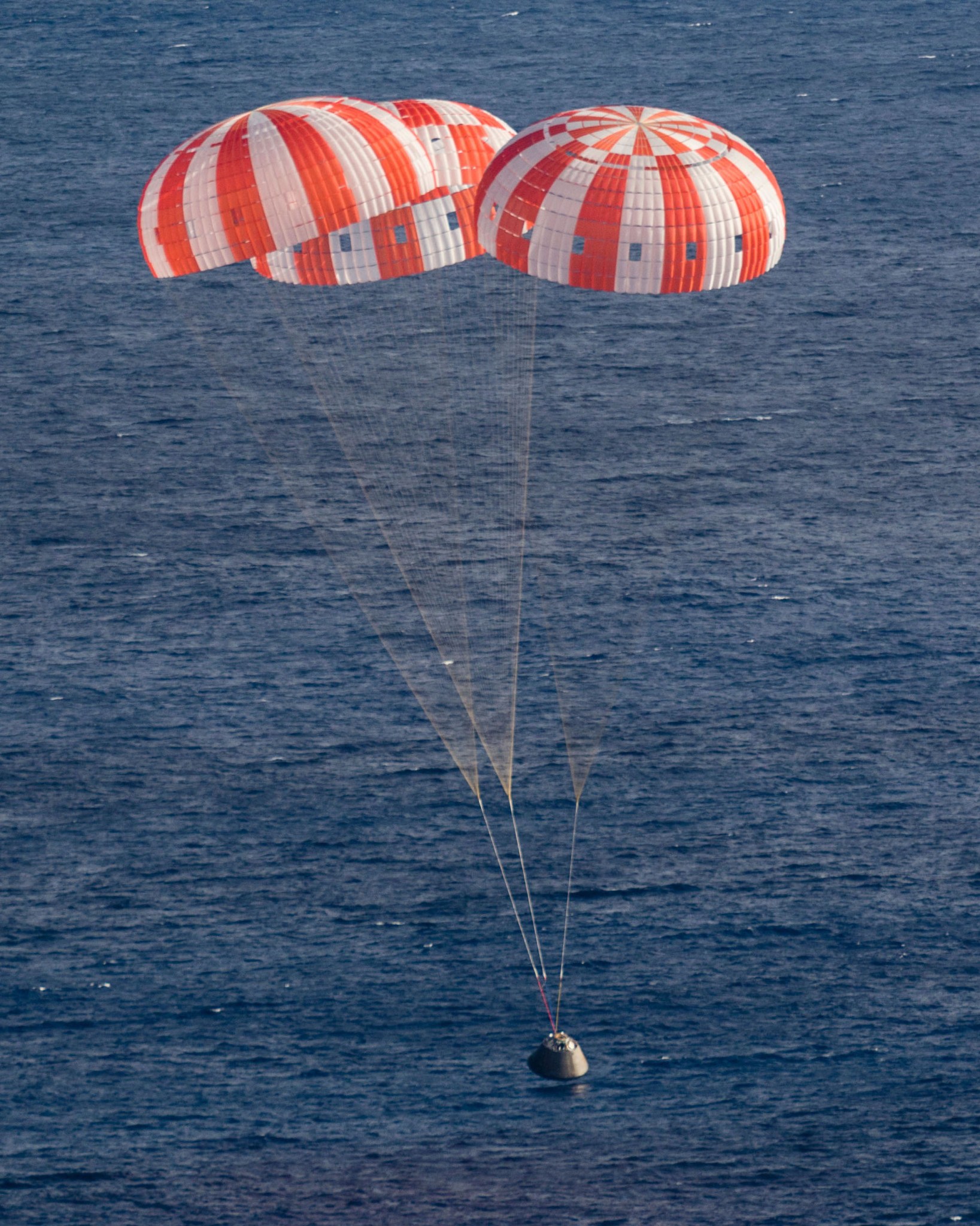The Orion returns from space and its deployed parachute systems worked well.