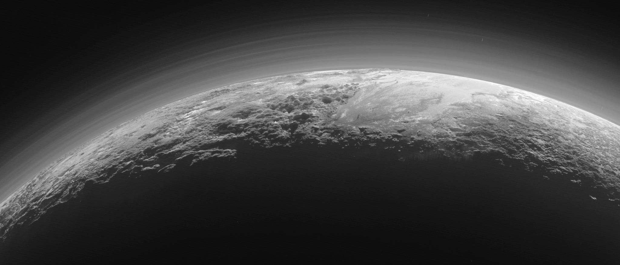 Pluto's mountains, frozen plains and foggy hazes.