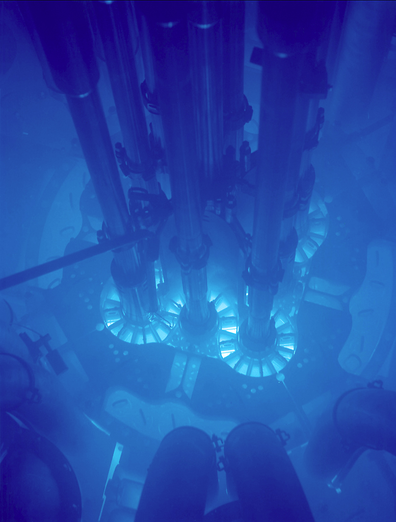 Nuclear fuel glows blue in a submerged reactor core