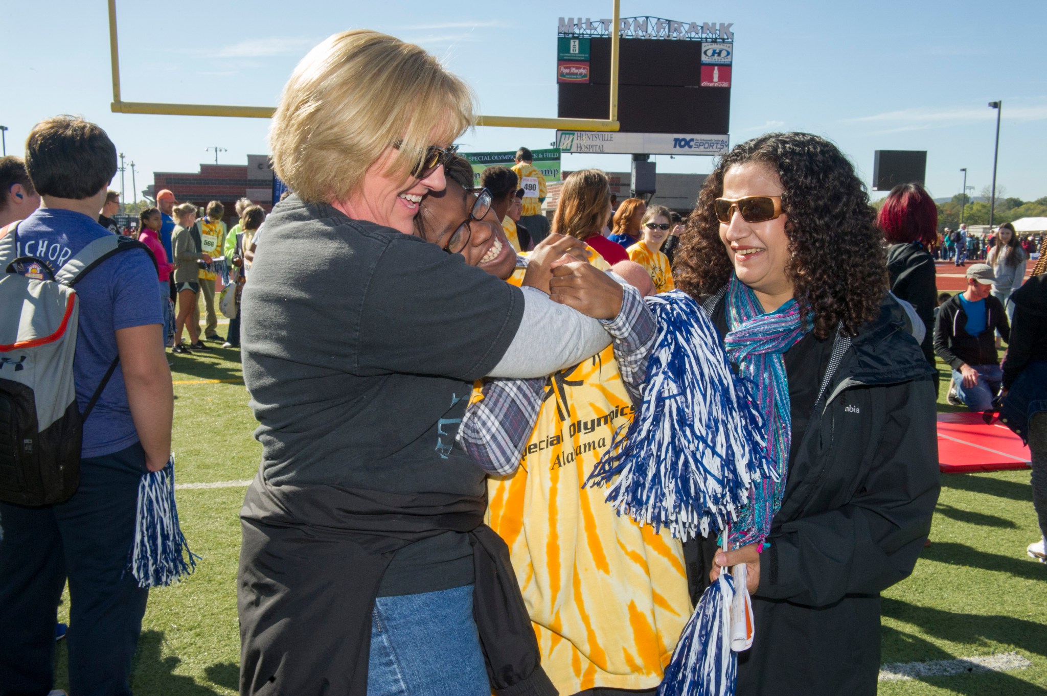 Betty Amos and Adesh Singhal congratulate Shamya Anderson