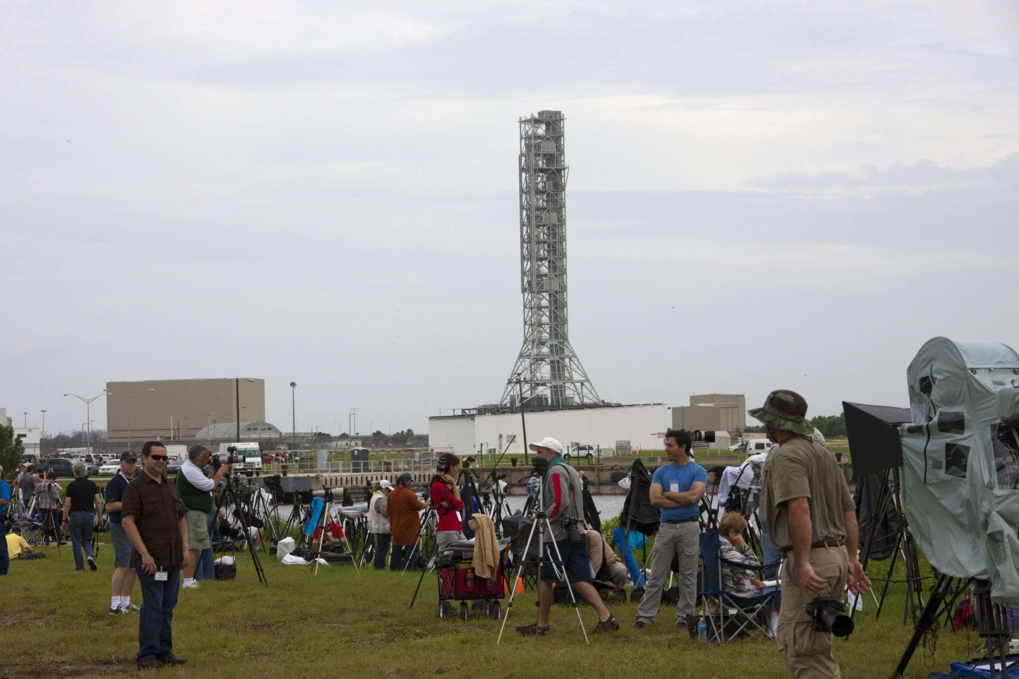 Media from around the globe gather at the NASA News Center at NASA Kennedy Space Center's Press Site in Florida