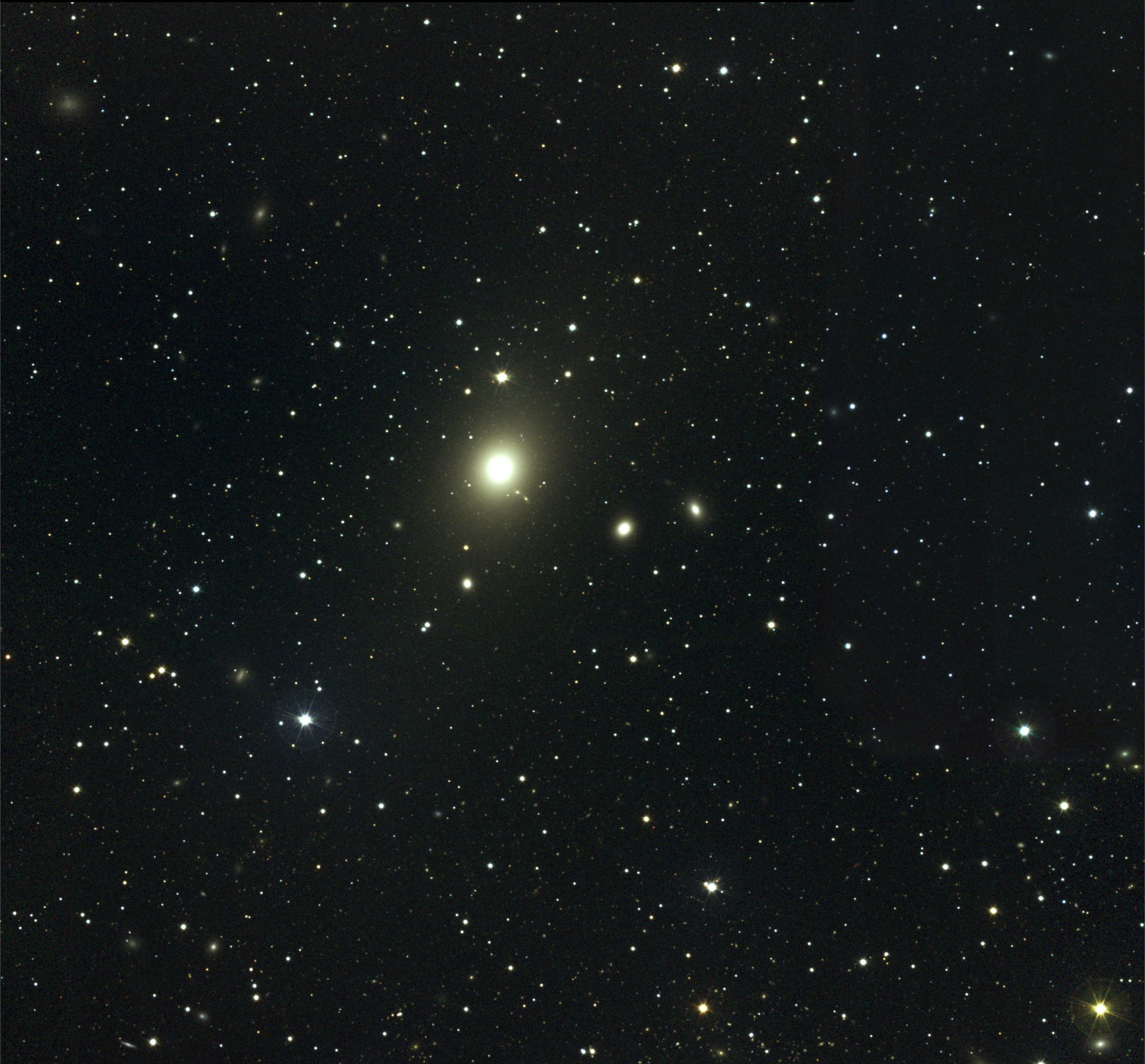This visible light view shows the central part of the Virgo Cluster. The brightest object is the giant elliptical galaxy M87.