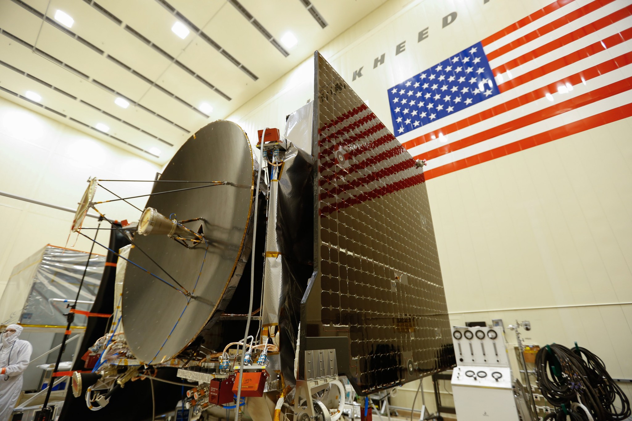 dish and solar panels, U.S. flag in background