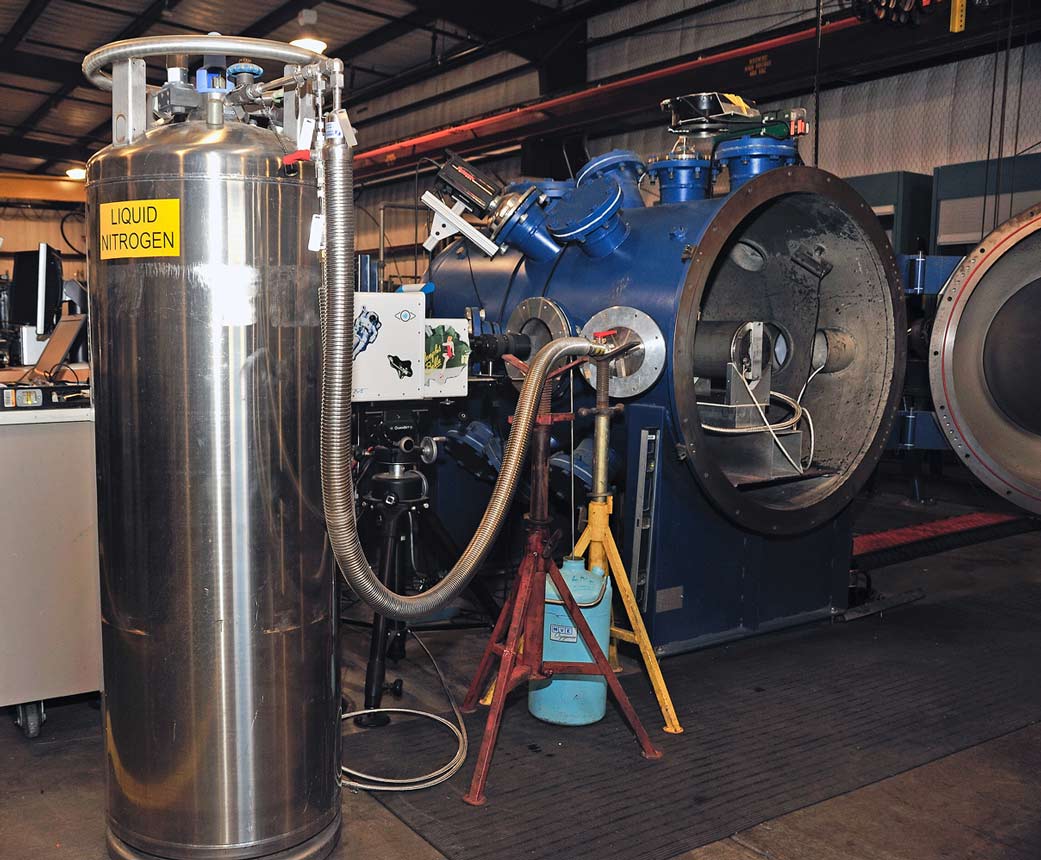 Sensors, cameras and other monitoring equipment is set up before a hypervelocity impact test is completed.