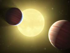 Artist's concept of two Saturn-sized planets.
