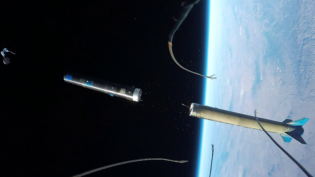 Nose fairing camera. view of an UP Aerospace booster separating in space and ejecting the Maraia capsule.