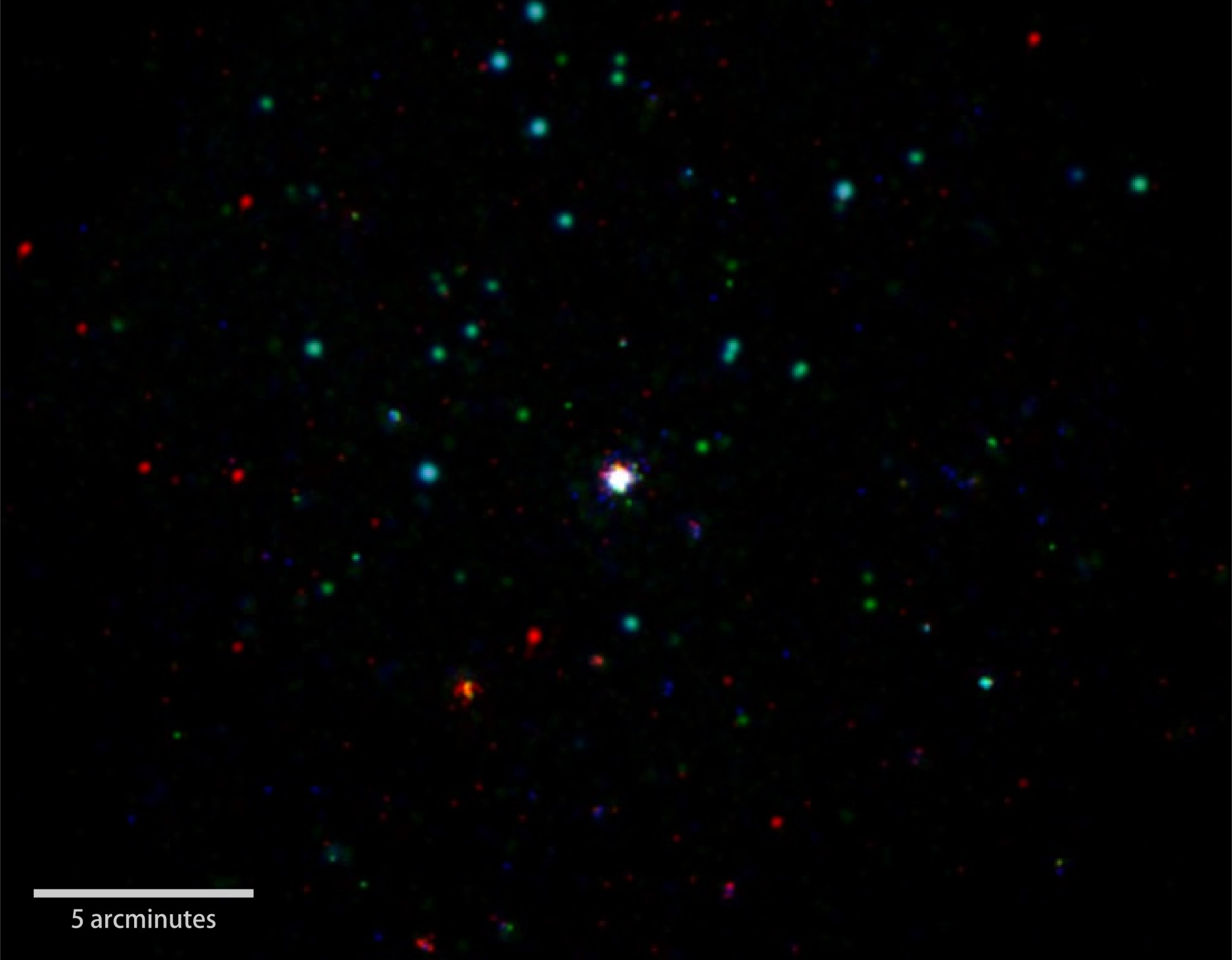 GRB 151027B, Swift's 1,000th burst (center), is shown in this composite X-ray, ultraviolet and optical image