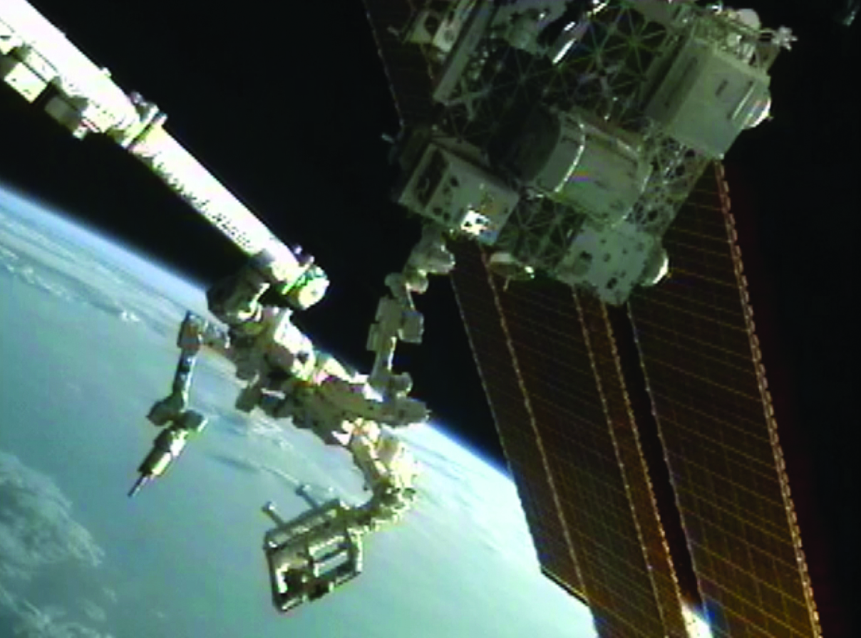 The Robotic Refueling Mission investigation (center, on platform) uses Canadarm2,