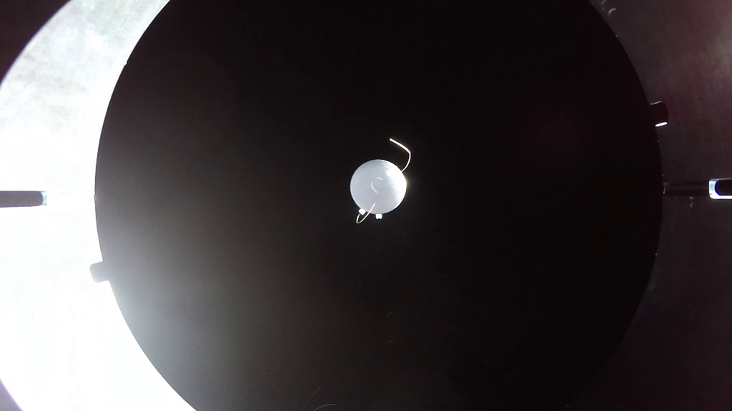 An UP Aerospace camera mounted on the launch vehicle shows the Mariai capsule after ejection and returning to Earth.