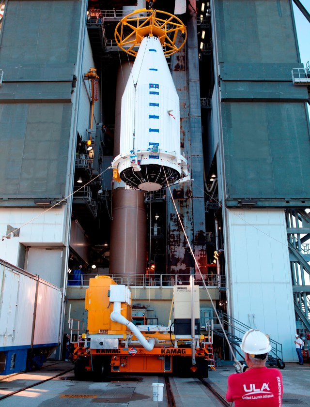 Cygnus spacecraft leaving a metal building