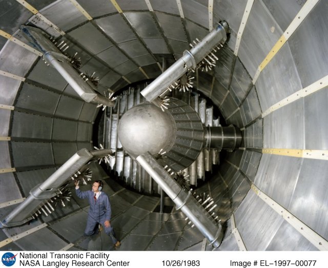 Image of Dennis Fuller inside the National Transonic Facility below the liquid nitrogen injection nozzles.