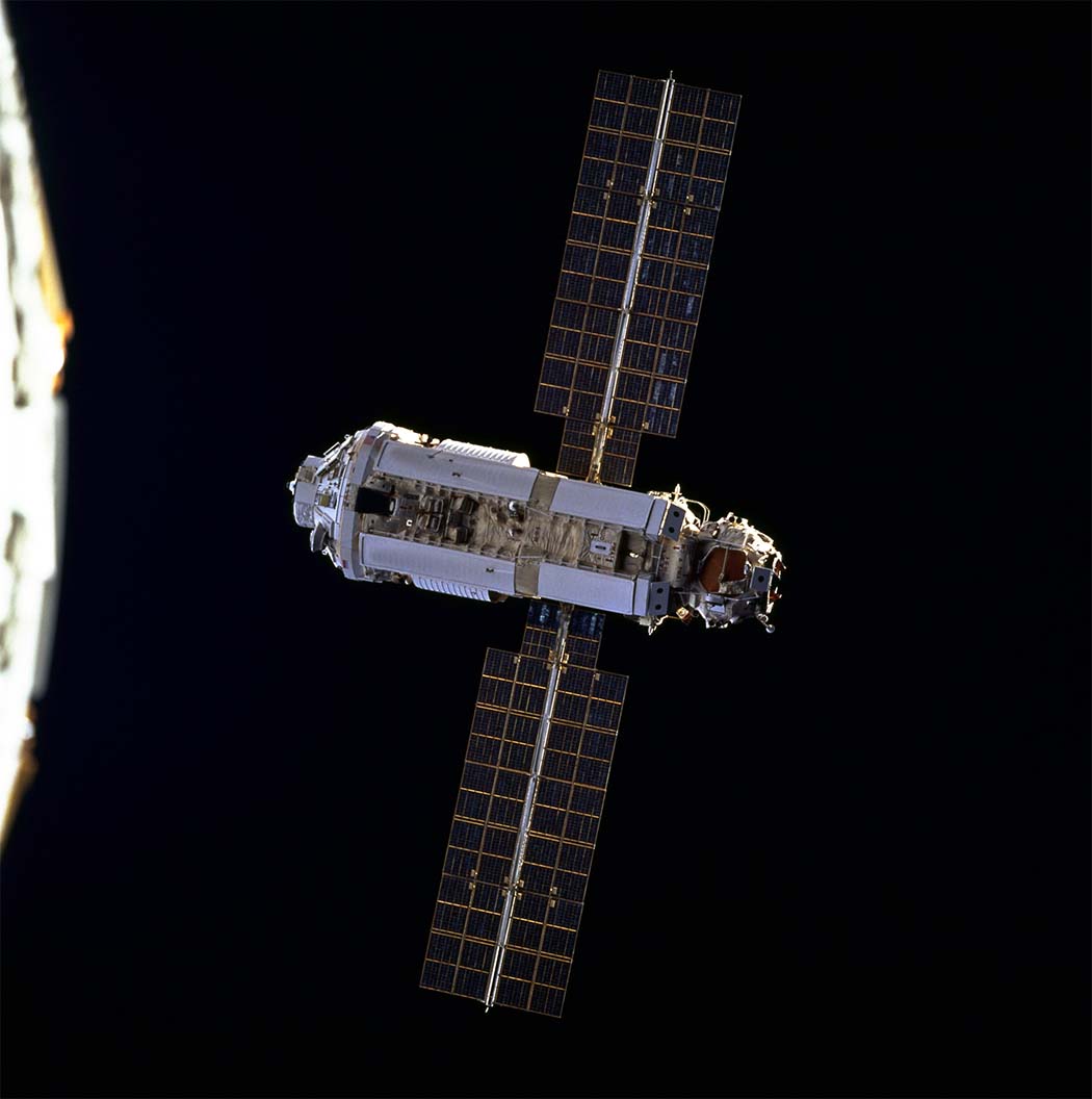 Zarya module with solar panels on each side, shown in space before other space station modules were attached