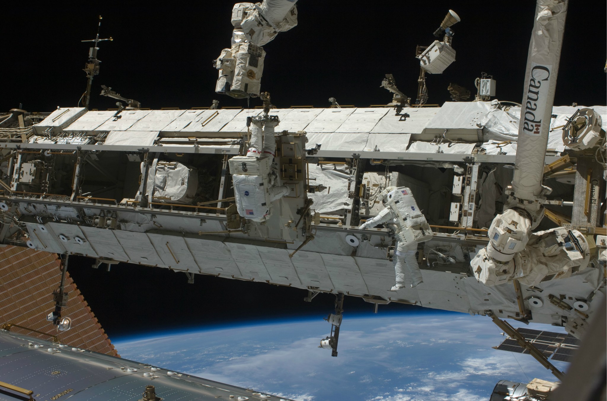 NASA astronauts Joe Acaba, left, and Ricky Arnold conduct a spacewalk in March 2009.