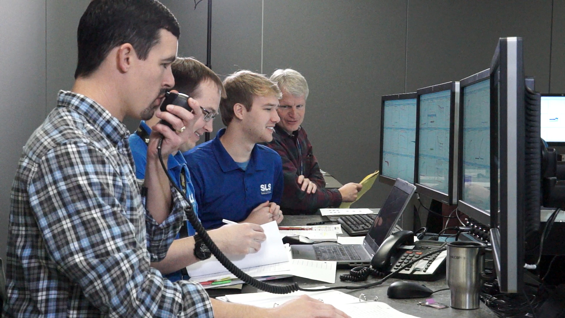 NASA and Boeing engineers conduct anti-geyser testing and monitor data from those tests in a control room at the Marshall Center