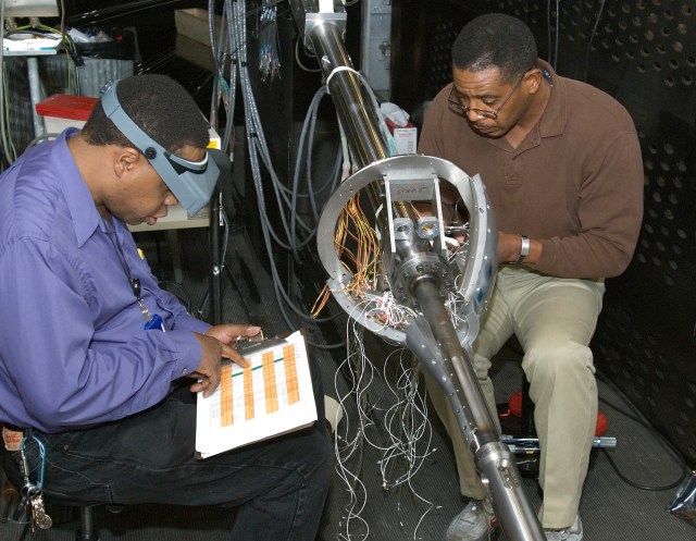 Two men working on the Aero Acoustic test.