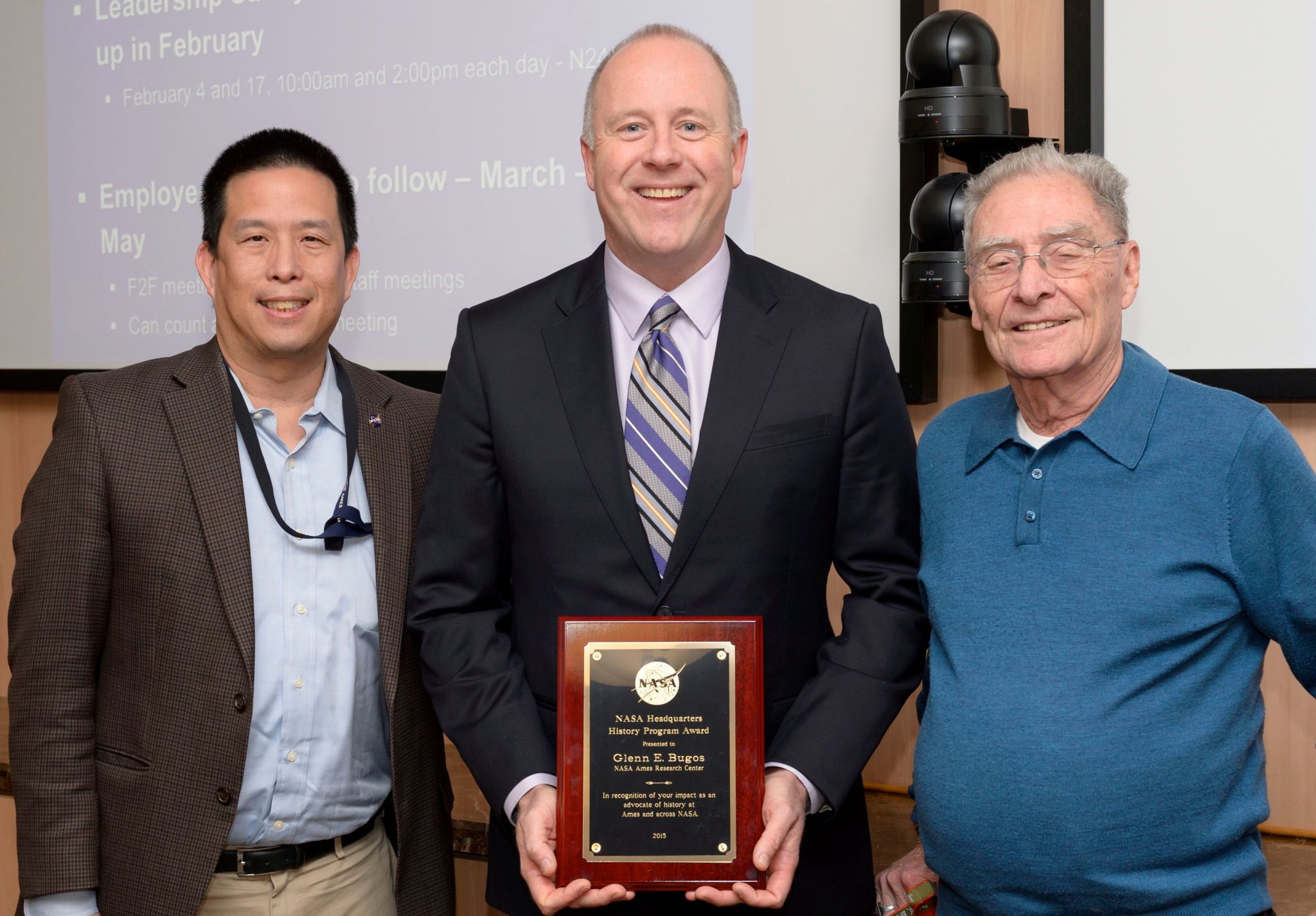 Glenn Bugos (center) earned the NASA History Award, recently presented to him by Ames Center Director Eugene Tu (left)