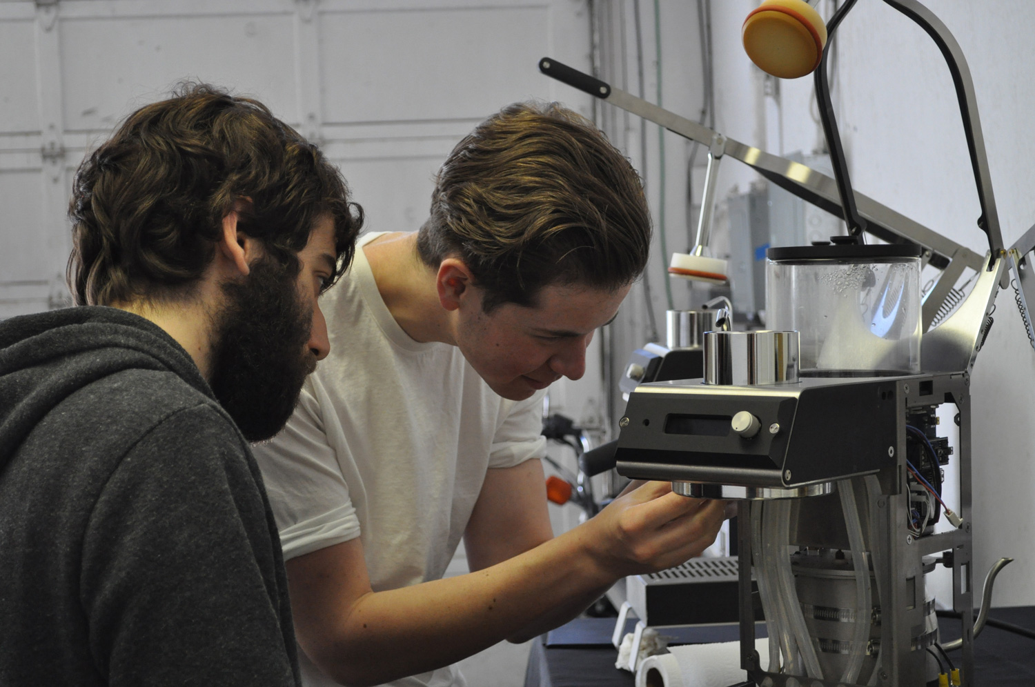Blossom team member analyze coffee maker
