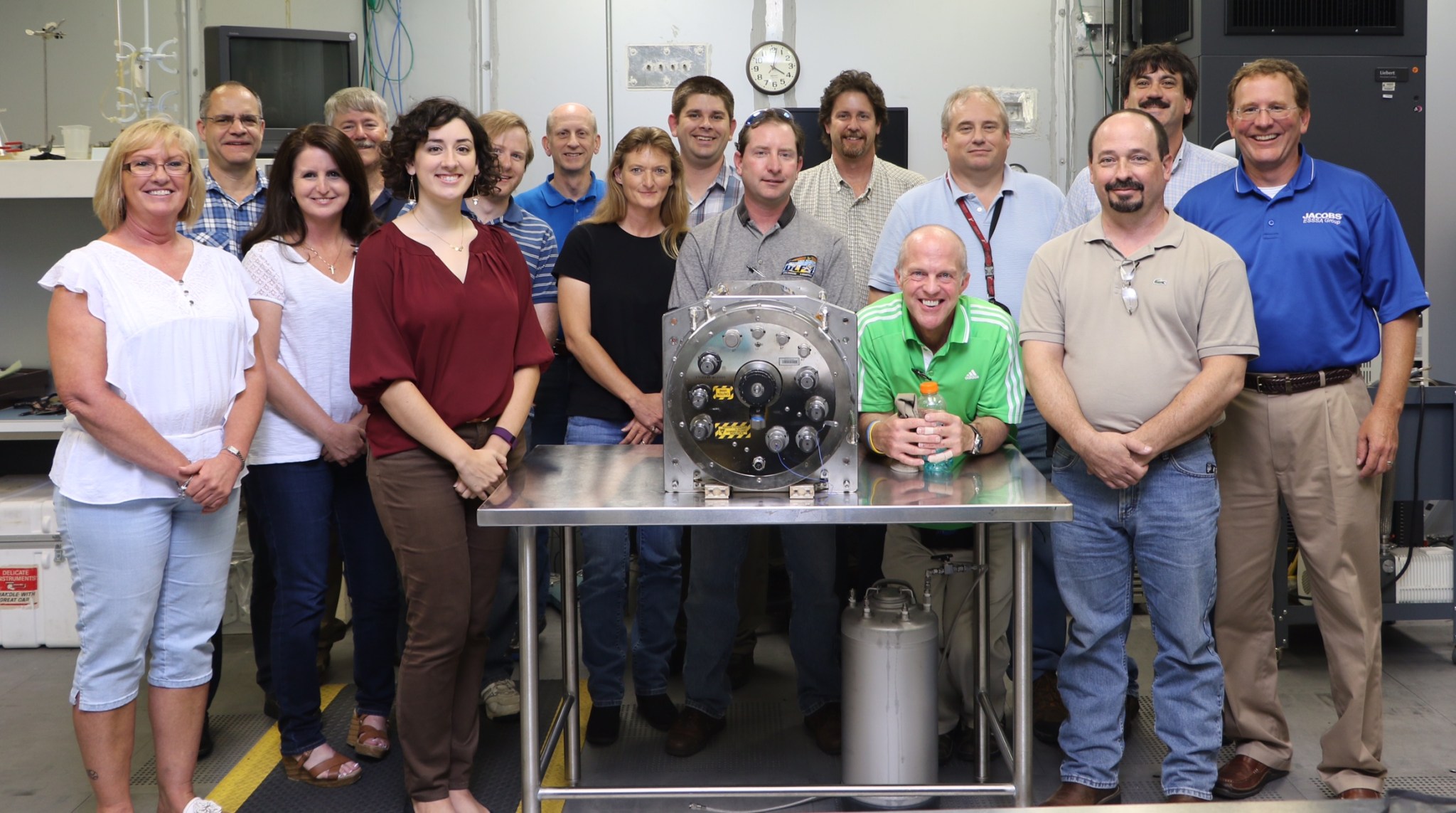 The Environmental Control and Life Support System team at Marshall celebrates the recently returned Distillation Assembly.
