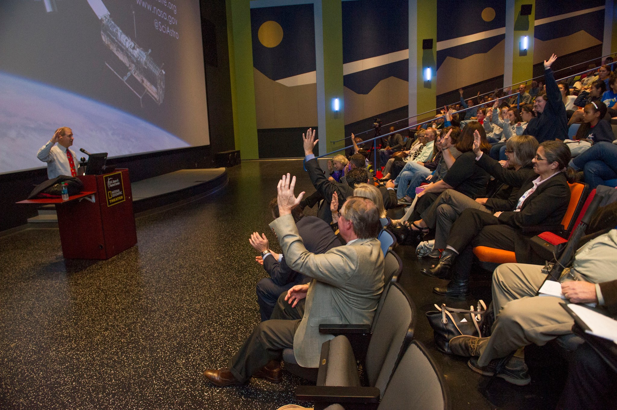 : John Grunsfeld, NASA's associate administrator for the Science Mission Directorate, addresses a public audience.