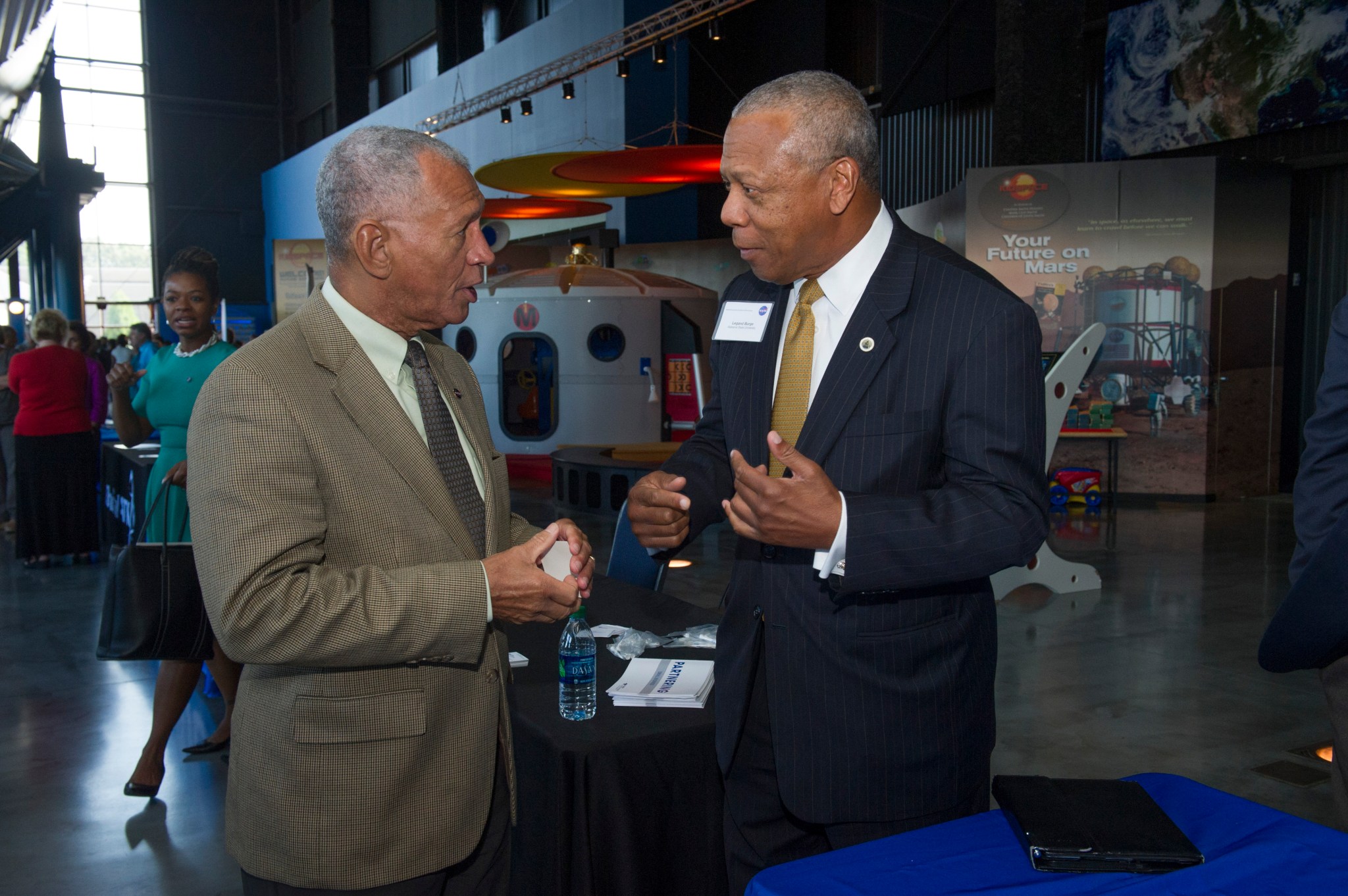 NASA Administrator Charles Bolden, left, speaks with Legand Burge of Alabama State University