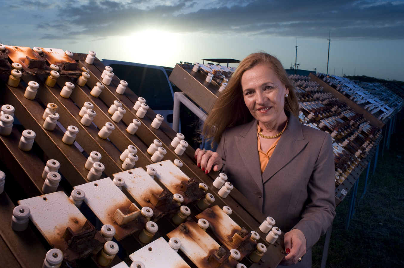 Dr. Luz M. Calle, the technical lead for Kennedy Space Center’s Corrosion Technology Laboratory, checks out sample tiles at the 