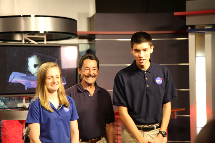 OPTIMUS PRIME challenge winners from 2015 pose in the NASA Goddard TV studio with Peter Cullen