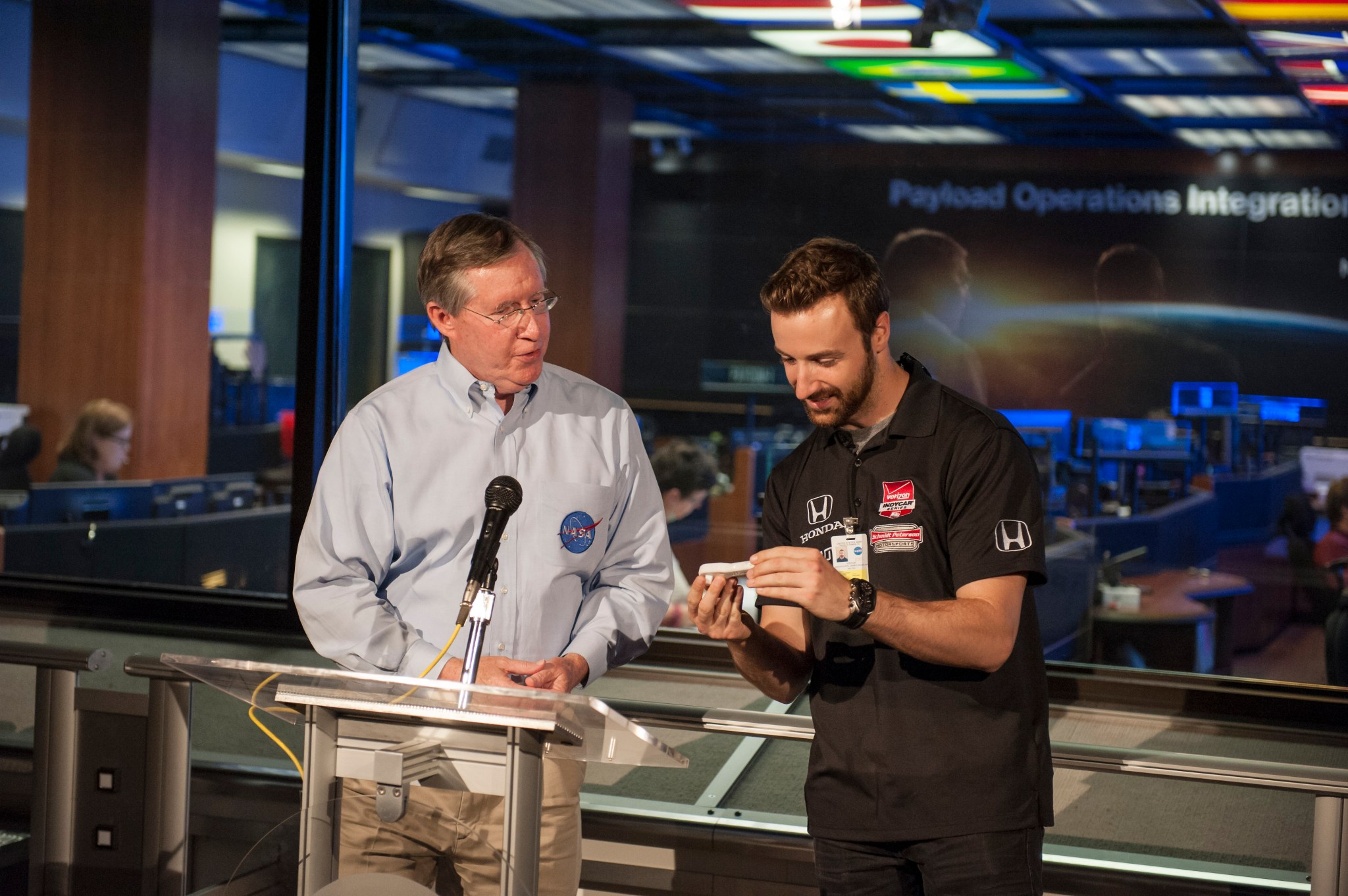 Corky Clinton, left, presents James Hinchcliffe with a 3D printed ratchet during his Marshall visit.