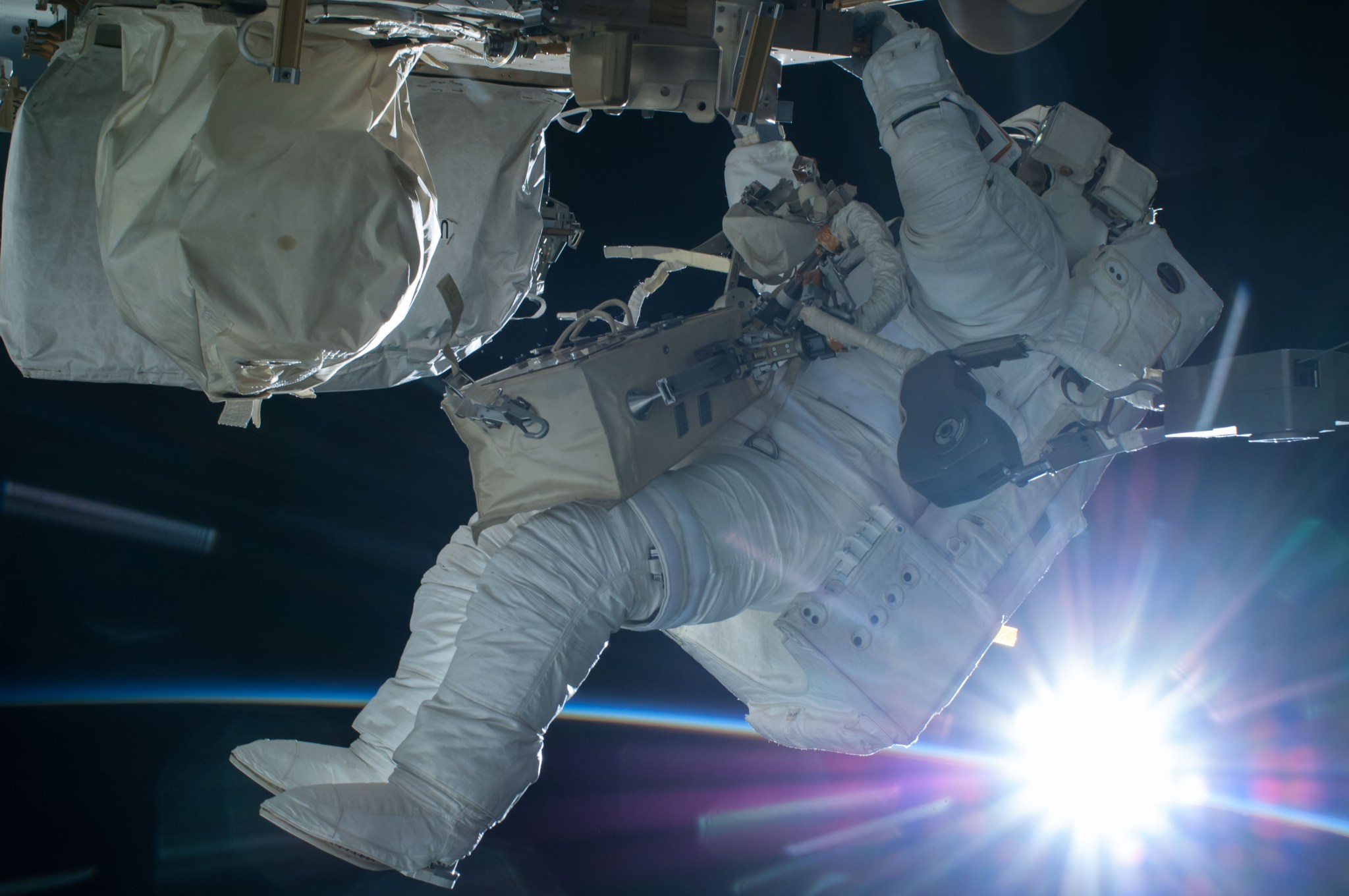 Astronaut Terry Virts conducts a spacewalk during an orbital sunrise on Feb. 21, 2015. 