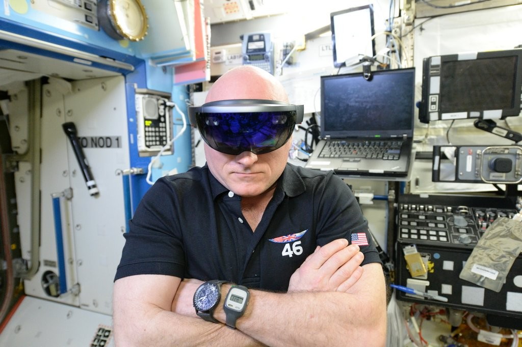 NASA astronaut Scott Kelly performing checkouts for NASA's Project Sidekick, which makes use of Microsoft's HoloLens device.