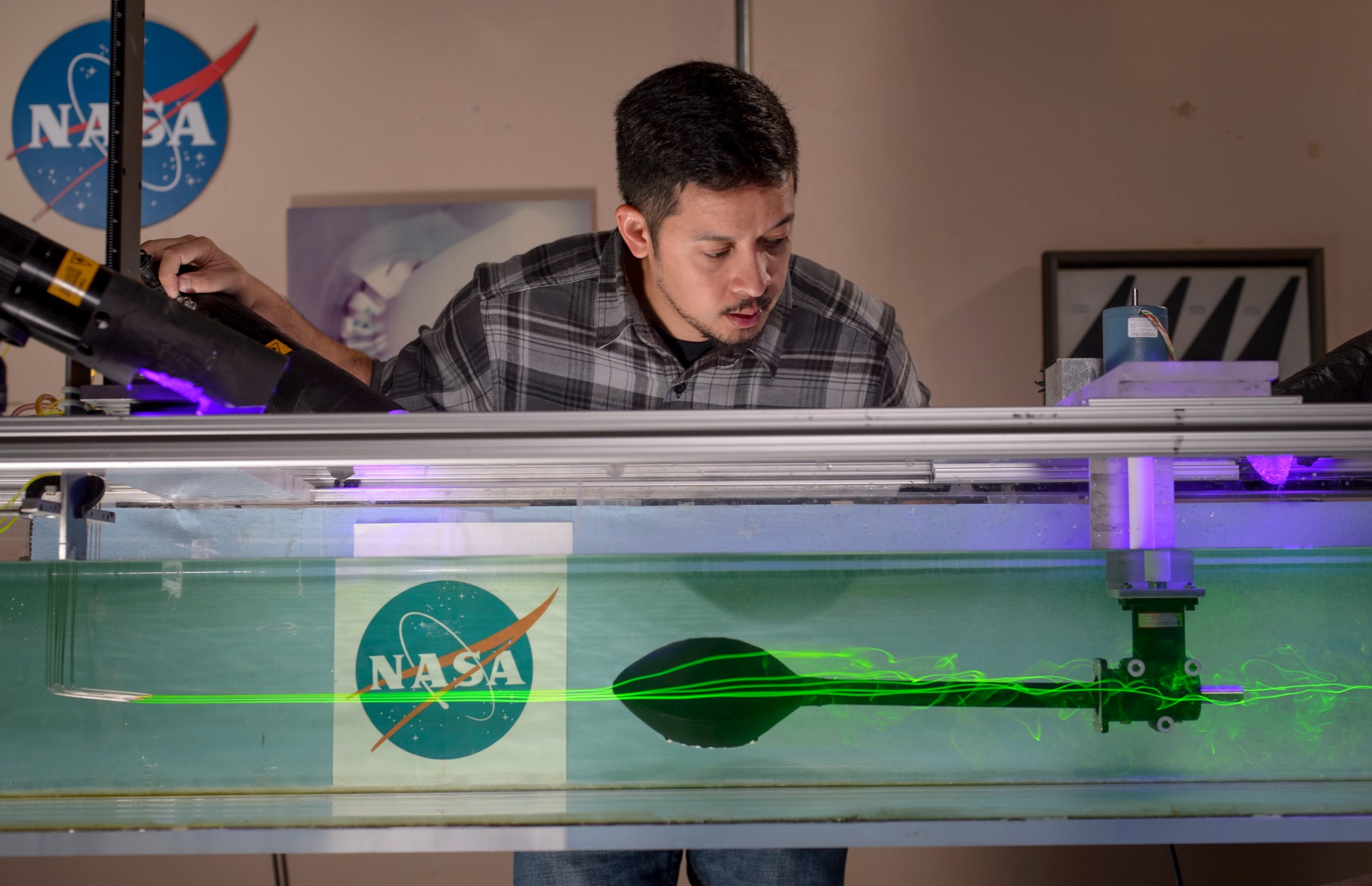 Image shows florescent dye shows a straight line in front and wakes behind the football