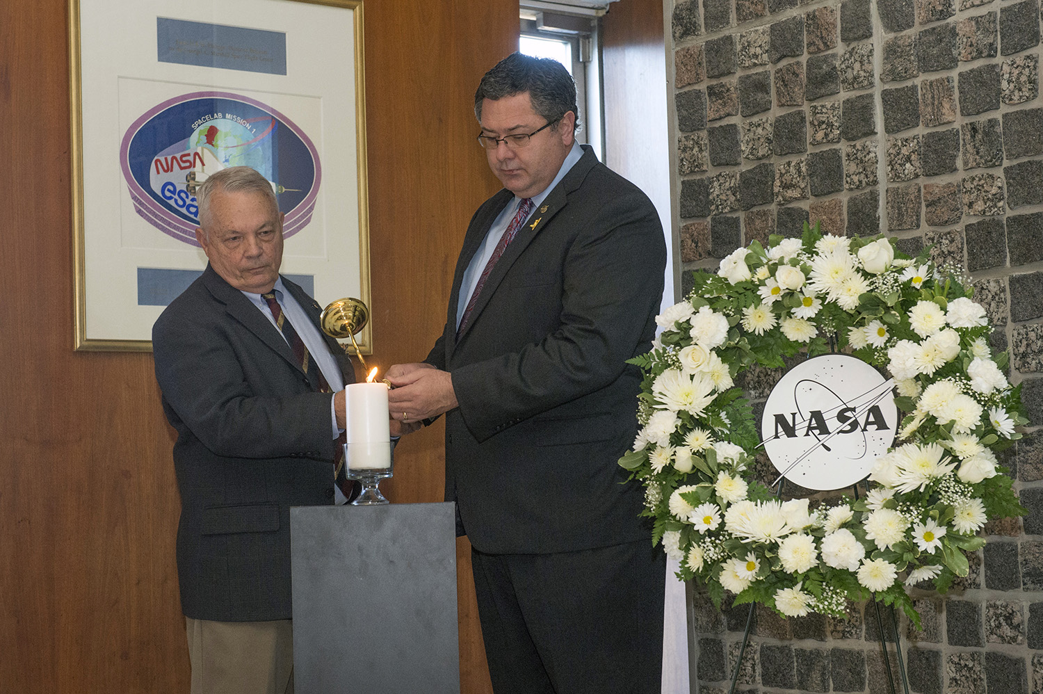 Former NASA astronaut Bob Stewart, left, and NASA Marshall Space Flight Center Acting Director Todd May.