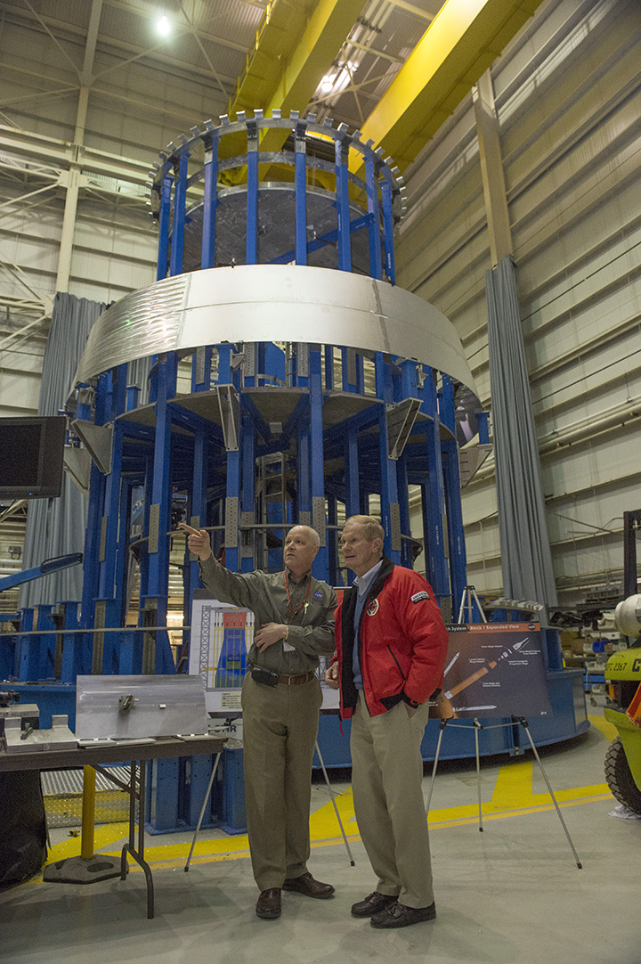 U.S. Sen. Bill Nelson of Florida, right, listens as Andy Schorr explains the progress of NASA’s Space Launch System.