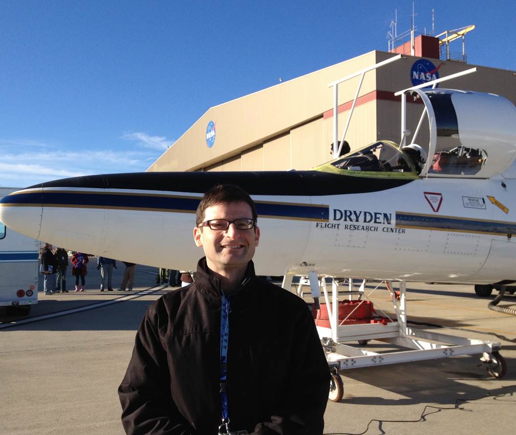 Robert Levy outside hangar with airplane