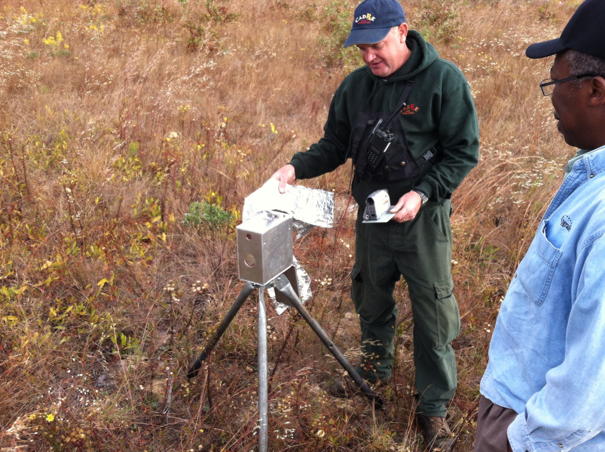 Ichoku watches as one of the Forest Service Scientists sets up a ground-based instrument before the prescribed fires in the Flor