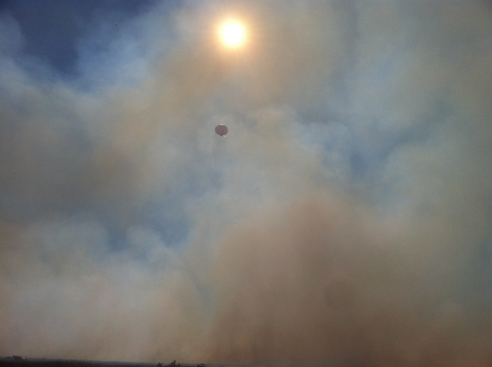 Smoke from one of the fires being sampled with instruments mounted on a tethered balloon from the US Environmental Protection Ag